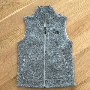 Grey North Face zip-up vest with multiple pockets (size M)